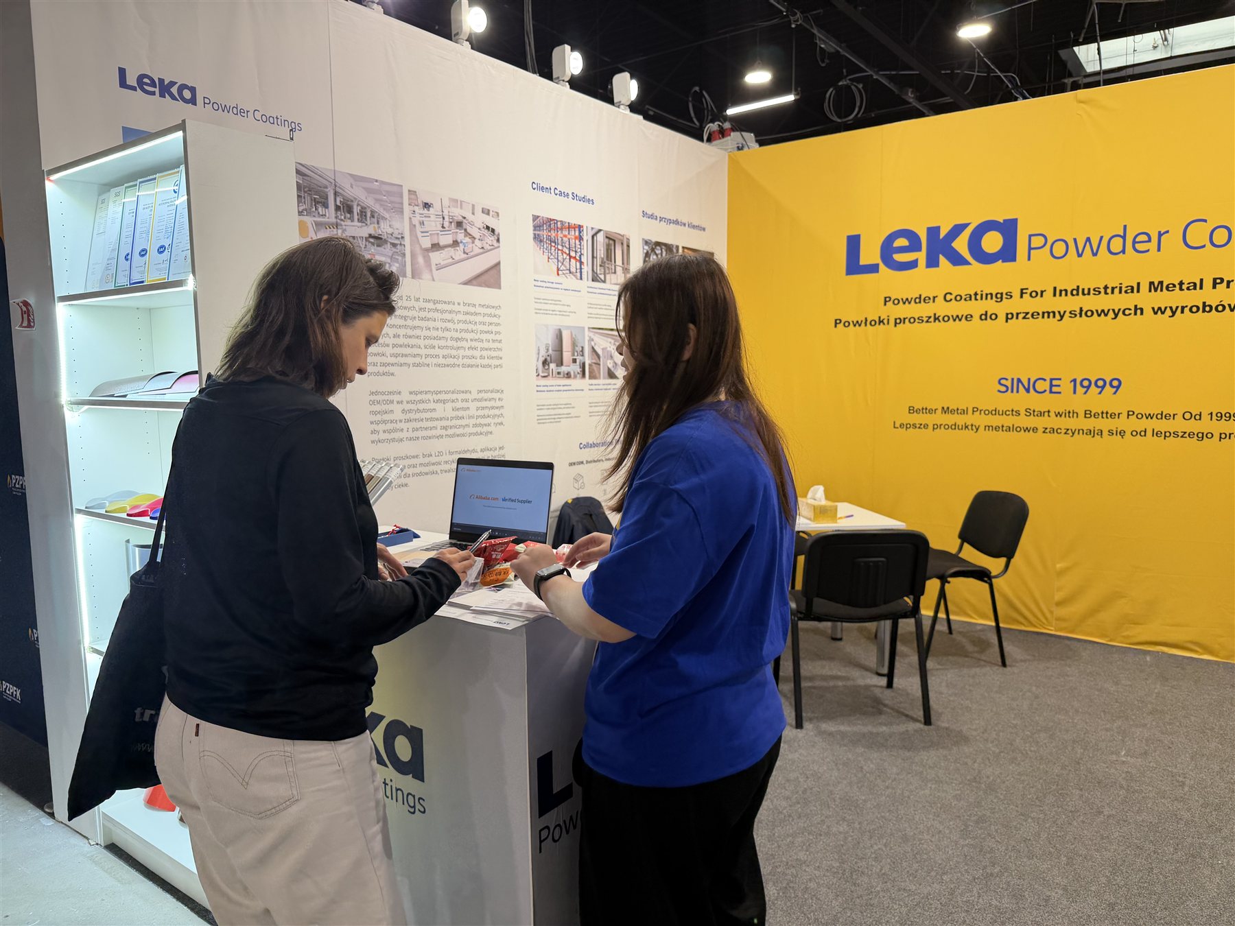 Technical discussion at the Leka Powder Coatings exhibition stand